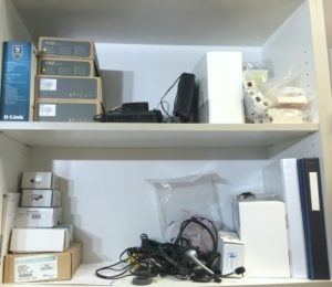 old electronics on mailroom shelf